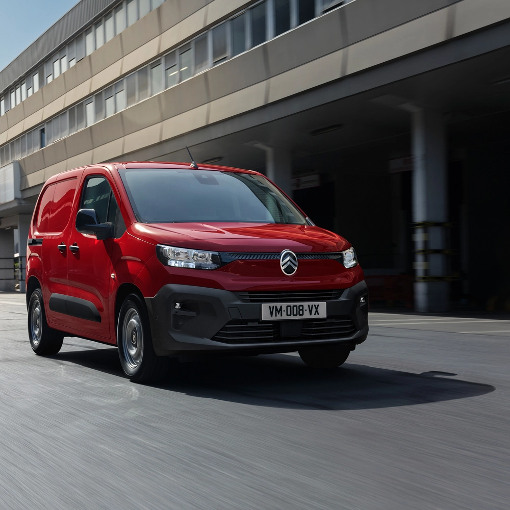 Man charging his red new ë-Berlingo Van