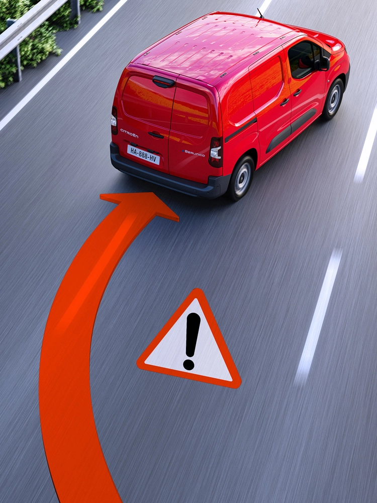 Vista posteriore di Berlingo Van che esce dalla corsia, con avviso di superamento involontario della carreggiata visualizzato sulla strada.