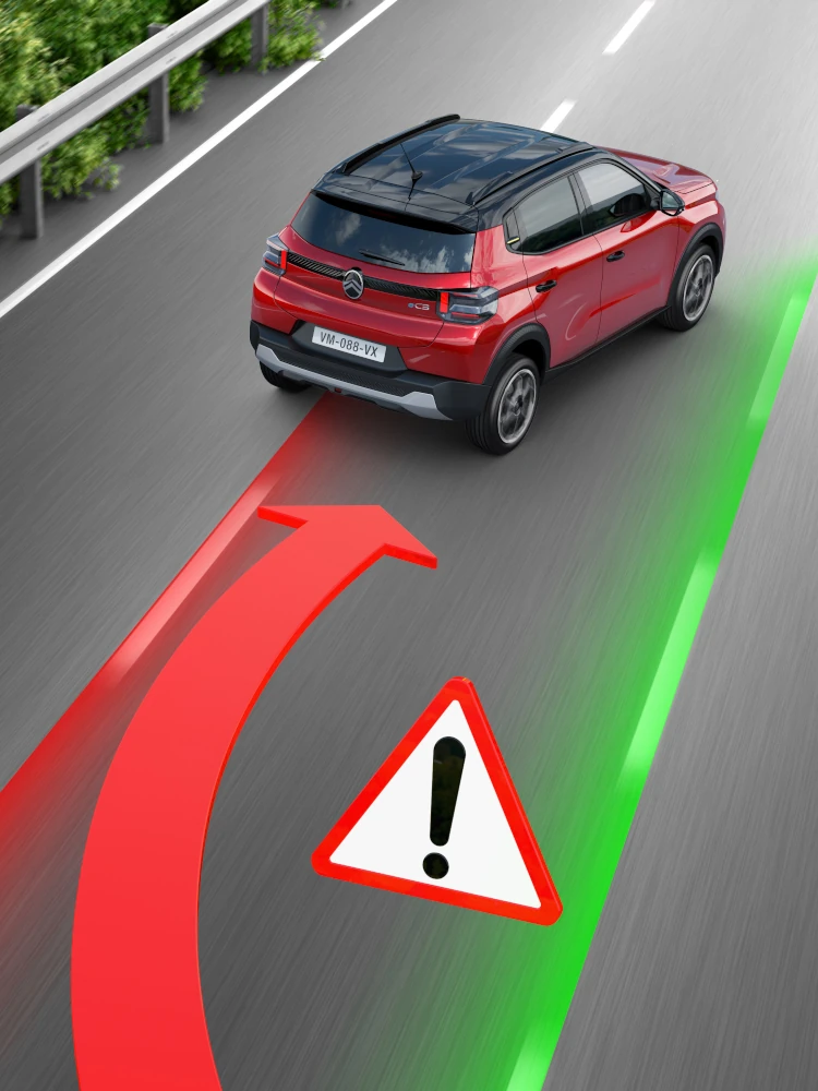 Vista posteriore degli interni in movimento di Citroën ë-C3 che mette in evidenza il Lane-keeping Assist, per una mobilità quotidiana più sicura, confortevole e accessibile.