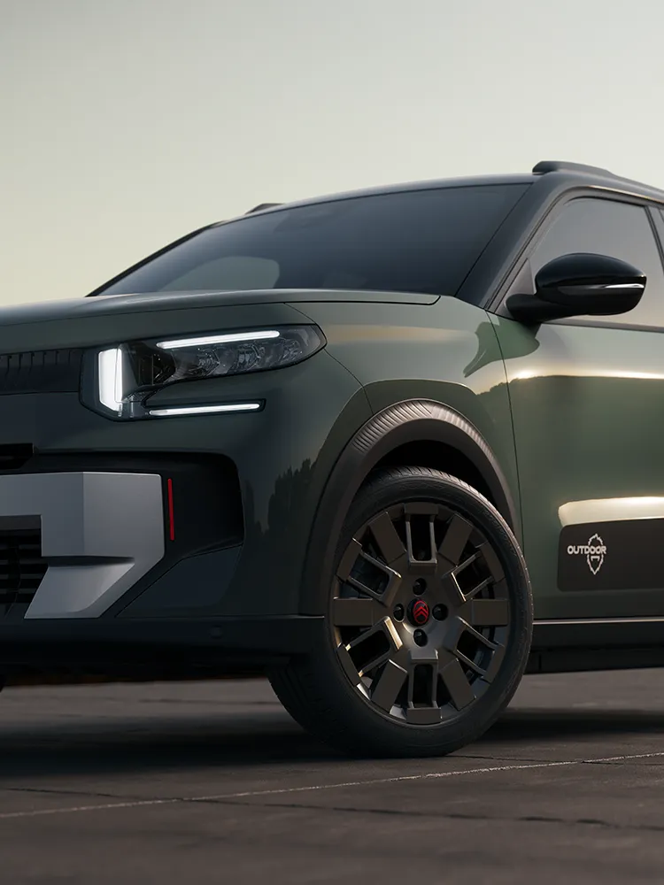 Vista ravvicinata anteriore di Citroën C3 Outdoor, con cerchio in lega e firma luminosa a LED, che mostra l'Advanced Comfort di questo SUV compatto